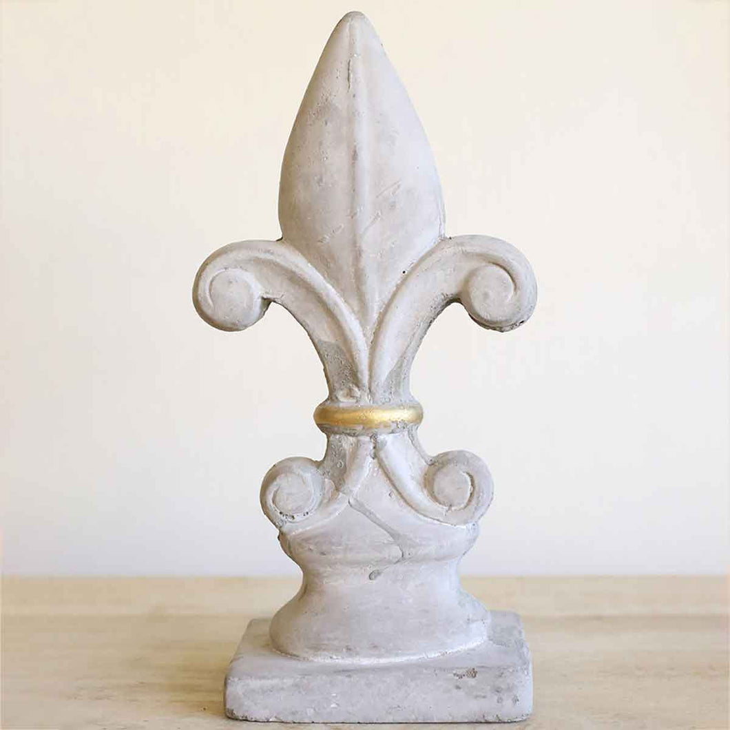 Fleur de lis design on smooth cement with metallic accent, 10.25 or 12.75 inches tall.