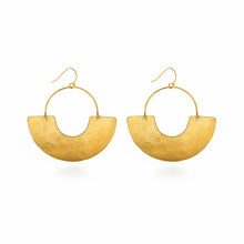Load image into Gallery viewer, Gold earrings, crafted from hammered brass, dangle elegantly from a branch. Handmade in the USA, packaged on our 3.5&quot; x 4.5&quot; cards.
