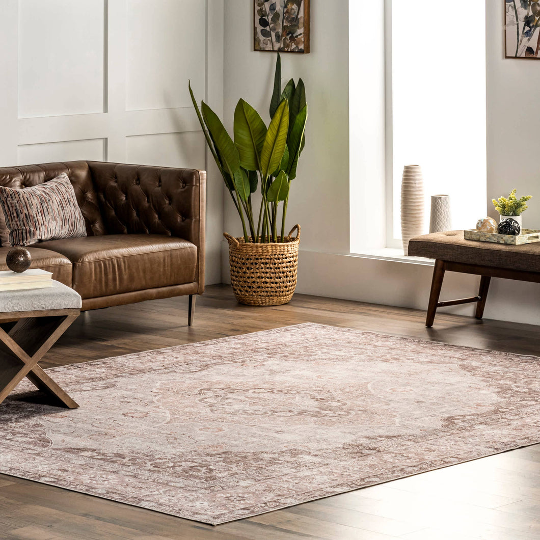 Sleek and sophisticated living room rug with a couch and coffee table, showcasing a modern Transitional Oriental design.