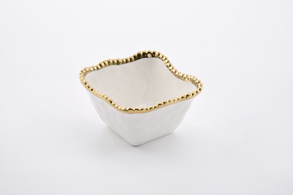Square snack bowl in Golden Salerno, ideal for individual snacking, dips, or toppings. Made of white porcelain with lustrous gold beads. Food safe, tarnish free, dishwasher and oven safe up to 500°. Easy Care.