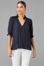 Load image into Gallery viewer, Chic top with lantern sleeves and notched neck, ideal for a night out or casual day. Unique design and shape add flair to your wardrobe!
