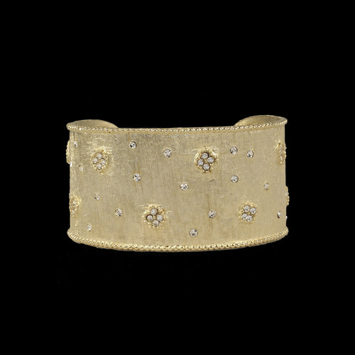 Elegant matte gold cuff featuring tiny pave flowers and diamonds, combining sophistication with a unique floral design.