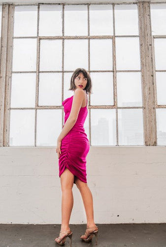 Glamorous Fuchsia Ruched Satin Cocktail Dress from Posh Couture. Luxurious satin fabric elegantly ruched to fit curves, with pleated hemline for an eye-catching twist. Feel glamorous and sophisticated.