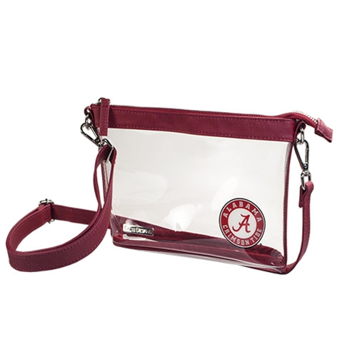 Stylish crossbody with clear PVC body, coated cotton canvas accents, and silver hardware. Zippered compartment for personal items. Convertible to clutch.