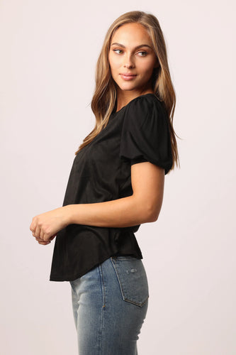 Versatile bubble short sleeve micro suede top with mixed knit finish. Solid color knit on standard fit. Perfect for any occasion.