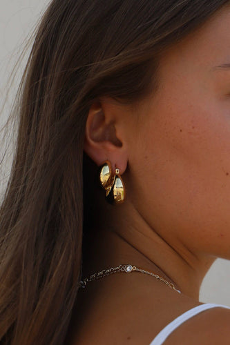 Coco Chunky Hoop Earrings: Thick gold hoops with a bold shape, adding sophistication to any outfit.