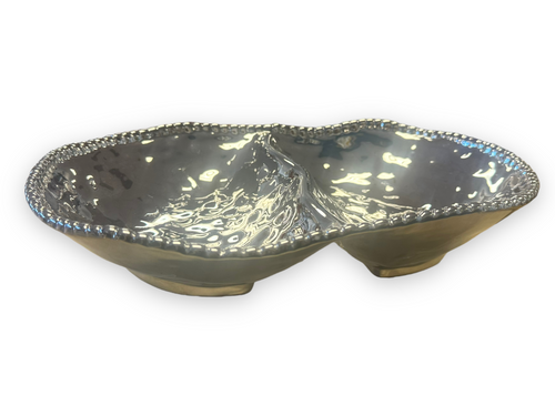 Festive holiday platter featuring an array of dips and small sides, ideal for entertaining guests.