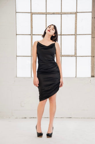 Black Cowl Neck Cocktail Dress - Posh Couture. A stylish and elegant dress with a black cowl neck design. Perfect for a sophisticated evening event.