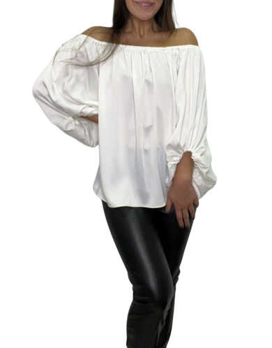 Stylish off-shoulder blouse featuring flat front, elastic rouching on sides and back. Long sleeves with wrist ruffle.