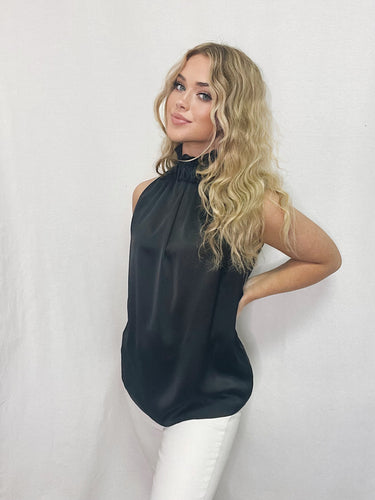 Sleeveless black mock shirt from Posh Couture, perfect for sophisticated occasions. Timeless design, luxurious fabric for a stylish and comfortable fit.